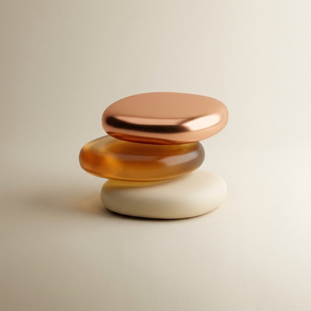 Three stacked forms in copper, amber and cream